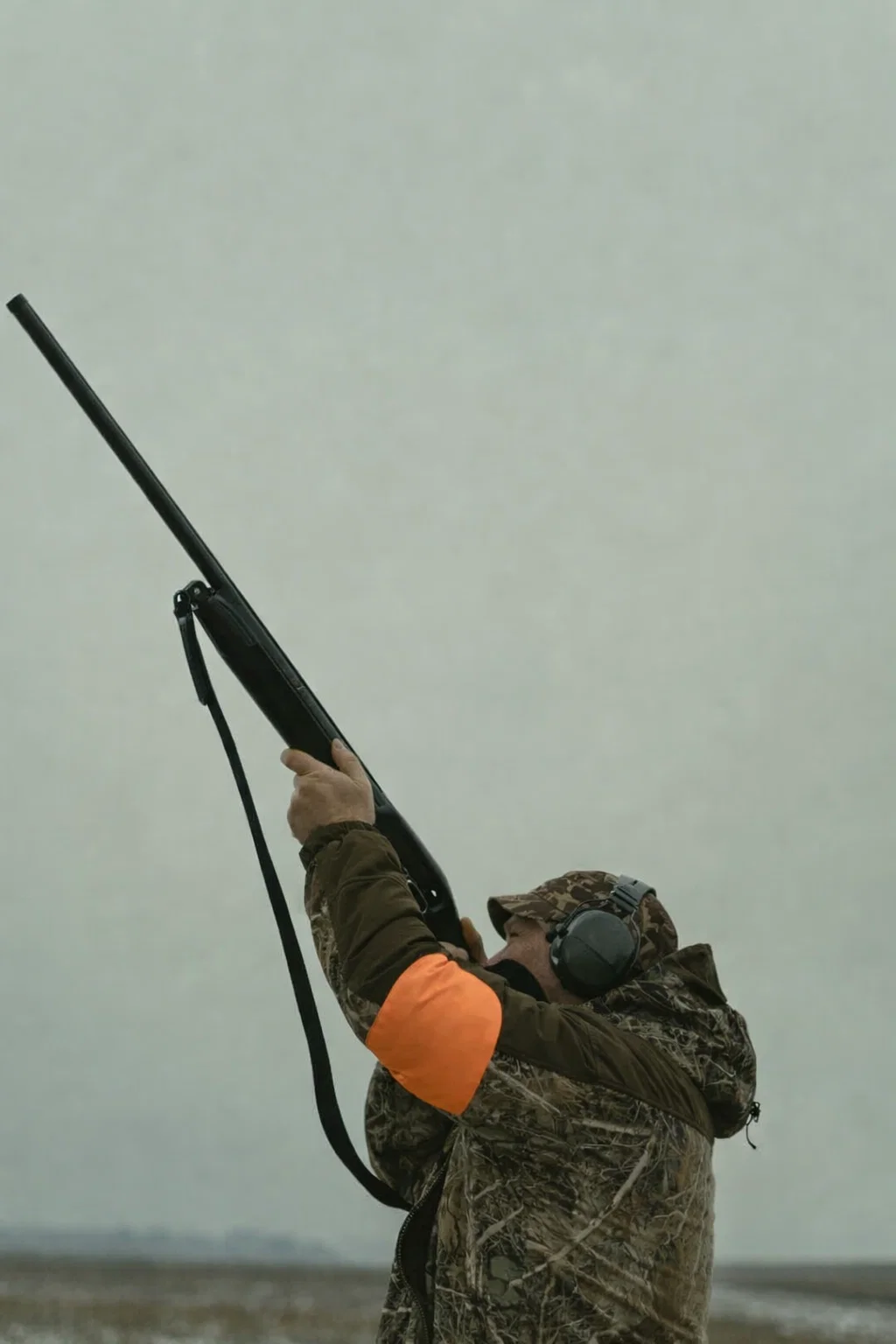 Shooter and precision sports participant wearing HYPƐAR custom hearing protection with impulse filter technology - Swedish-made 3D-printed custom-fit hearing protection with ANSI IPIL certified impulse filters protecting from gunshots and loud impacts while allowing communication